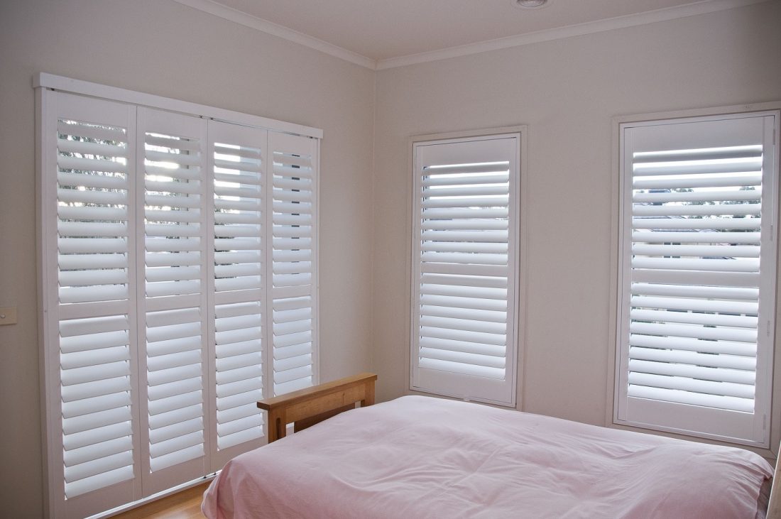 Various Custom Sized Window and Door Plantation Shutters Installed in Master Bedroom